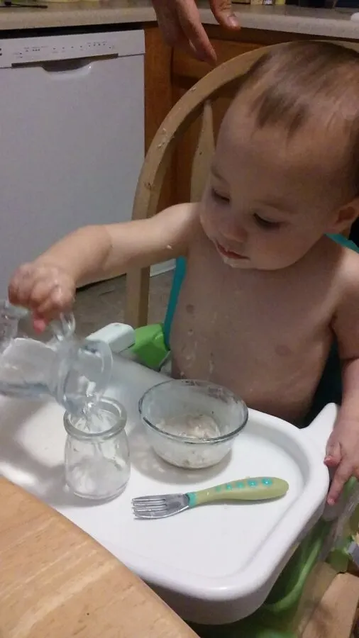 https://reachformontessori.com/wp-content/uploads/2017/09/montessori-child-pouring-water-in-glass.jpg.webp