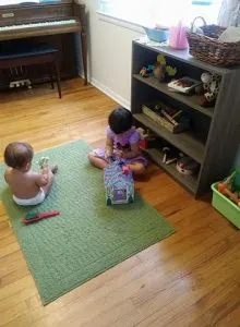 siblings sharing space during free play.