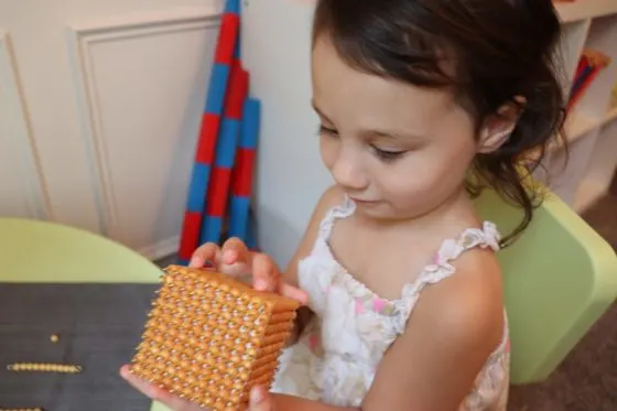 Child with Golden Beach Material. Used in the sensitive period for math.