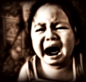 black and white image of toddler crying, tips for tantrums and meltdowns.