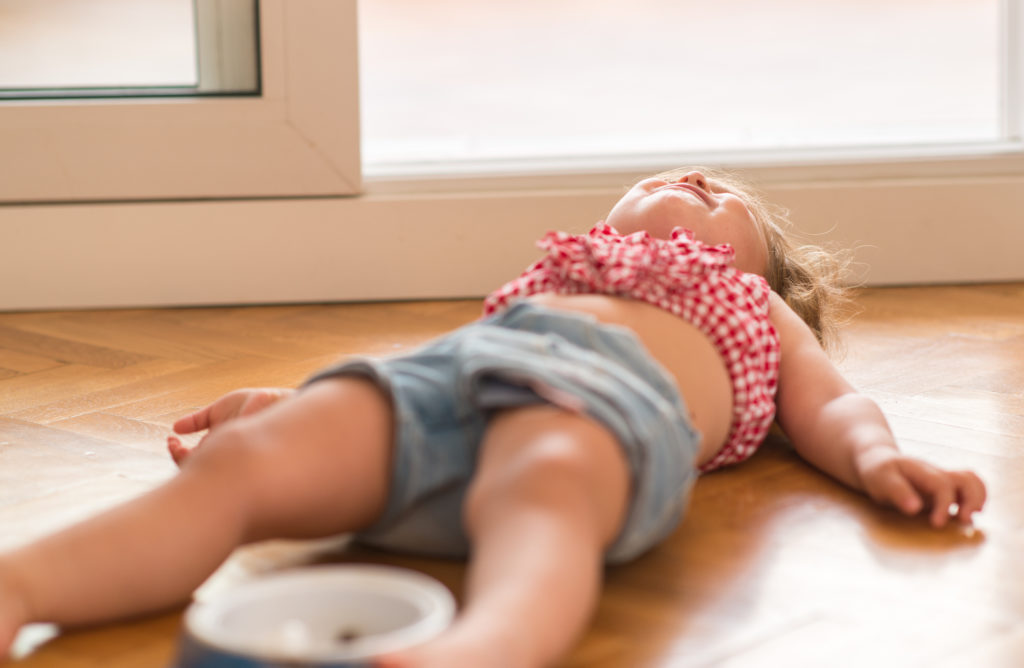 child crying on floor, tips to avoid tantrums and meltdowns.
