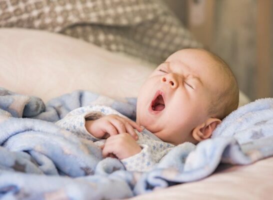 yawning sleepy baby.Gentle parenting and sleep training.