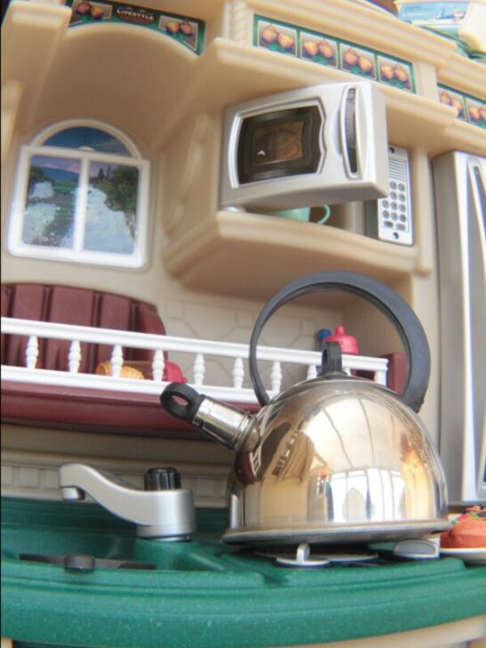 Play kitchen with tea kettle.