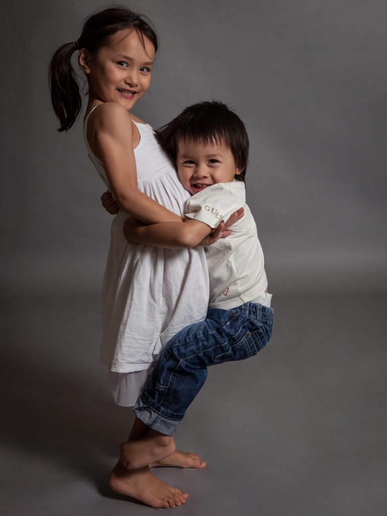 brother and sister hugging, when can i put my kids in a room together?