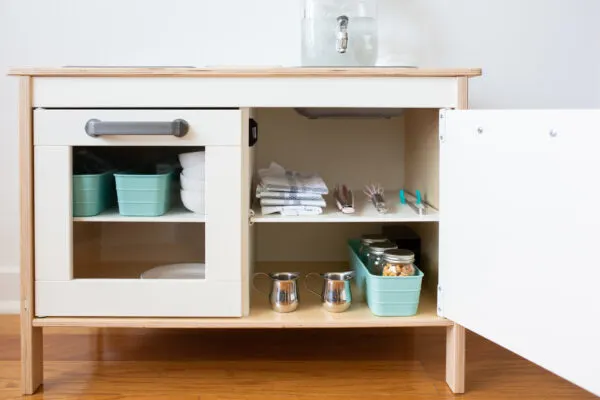 ikea montessori play kitchen with dishes.