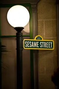 Sesame Street street sign and lamppost. Sesame Street is one of the quality tv programs for young children good for limited screentime.