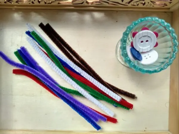 Pipe cleaners and buttons.