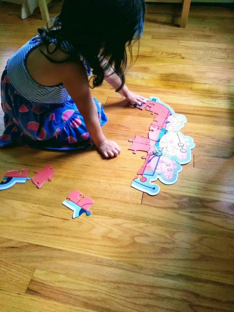 4 year old putting puzzle together. Puzzles are good for you.