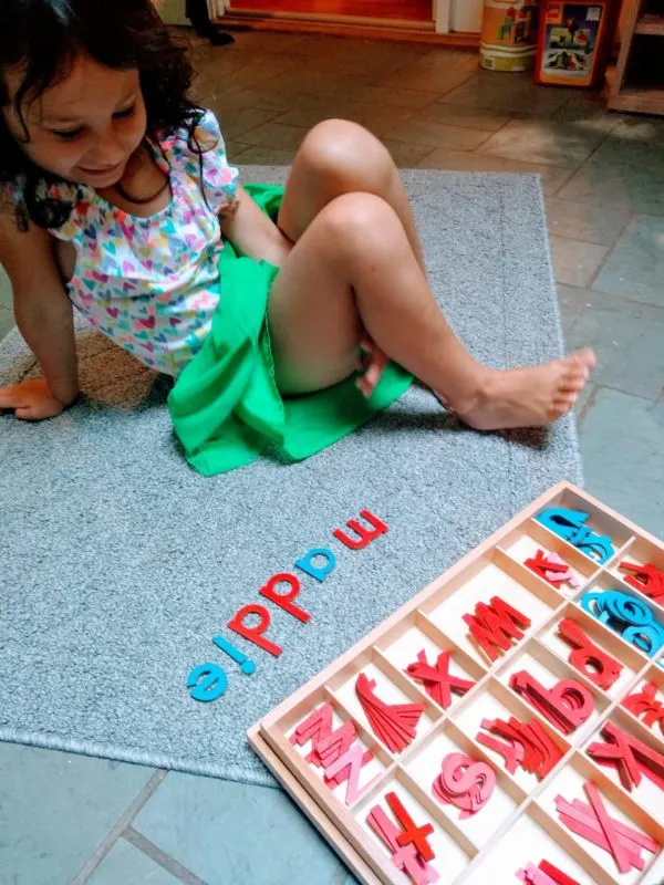Child working with Montessori Movable Alphabet
