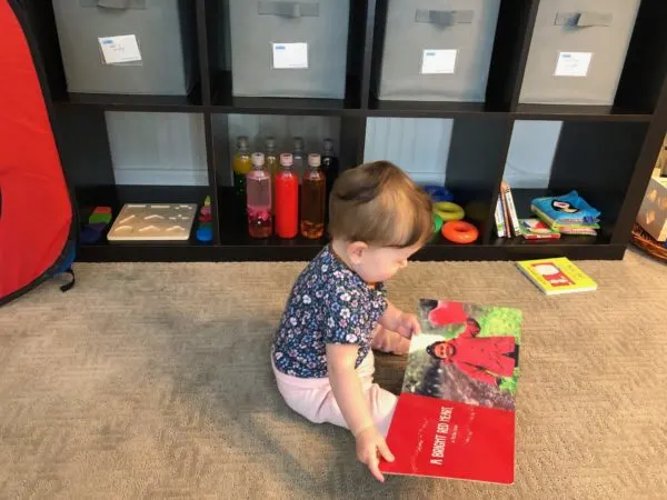 baby reading in yes space