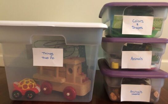 labeled toy storage bins for toy rotation for montessori at home.
