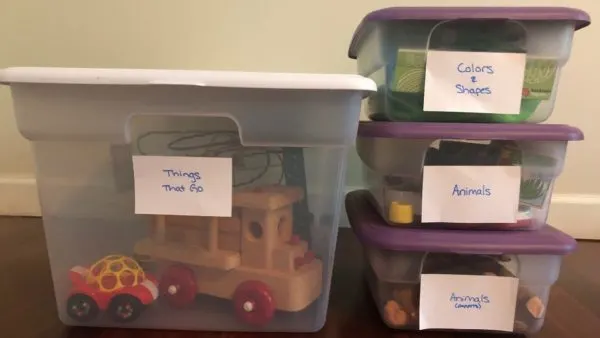 labeled toy storage bins for toy rotation for montessori at home.