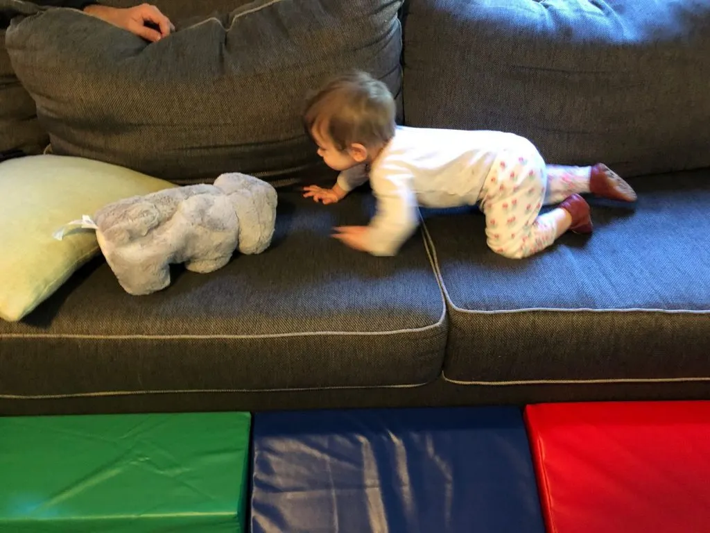 baby crawling on couch