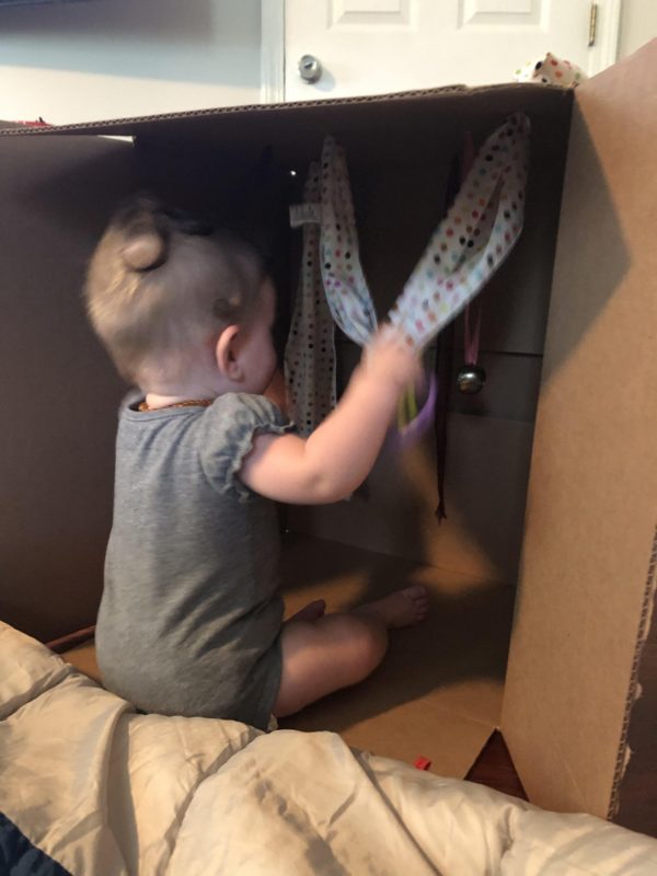 baby sitting in box