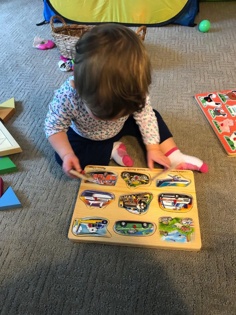 Baby doing puzzle, good for fine motor skills in babies.