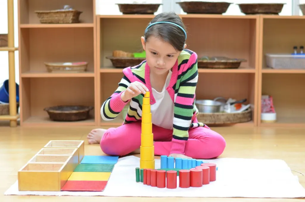 A child being creative with Montessori materials.