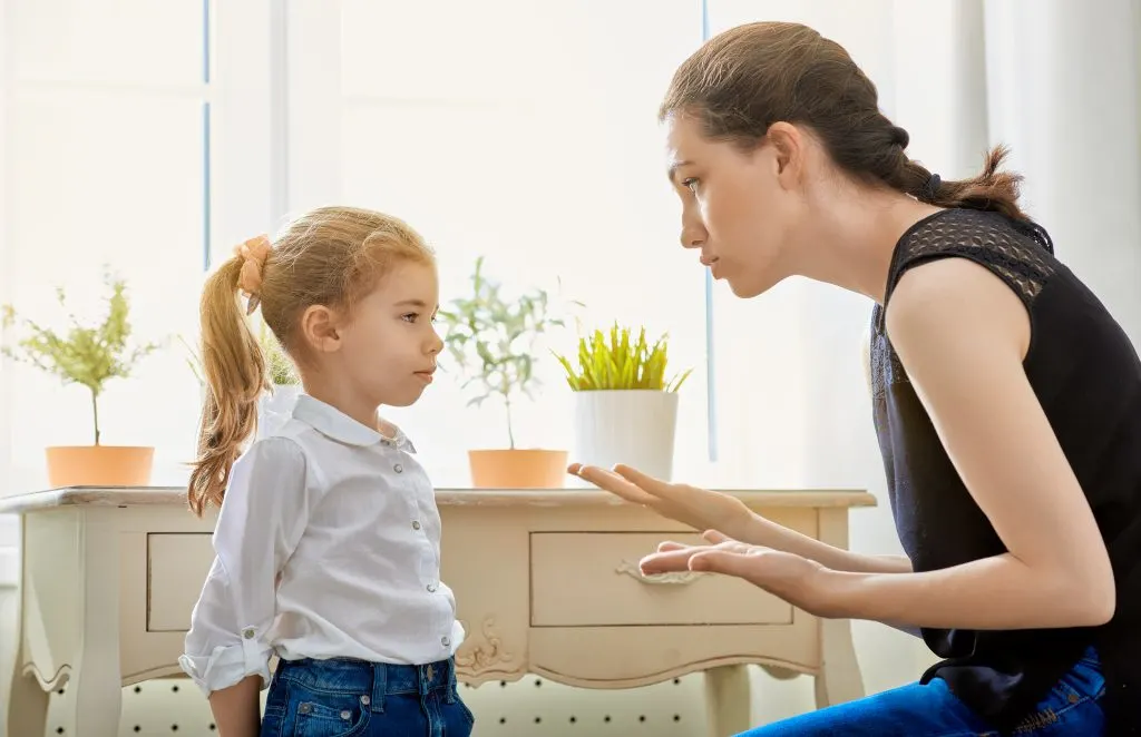 mom talking to child using time-in positive discipline.