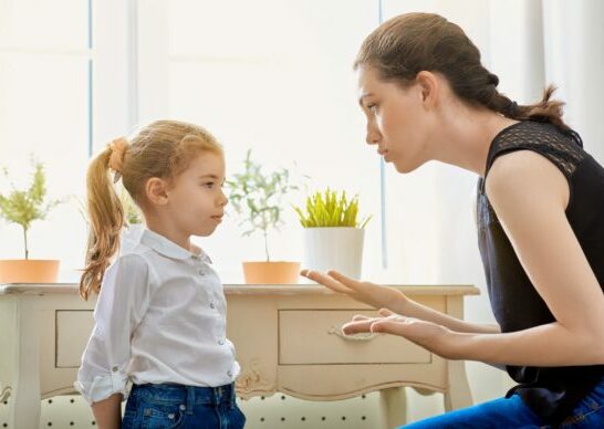 mom talking to child using time-in positive discipline technique.