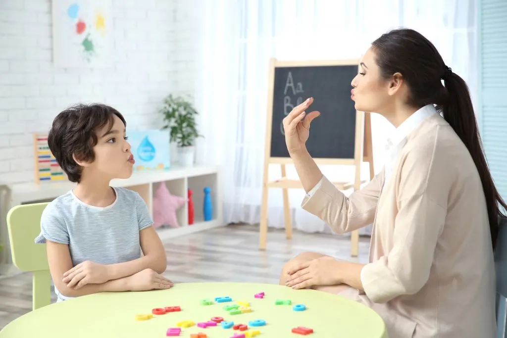 child working with occupational therapist