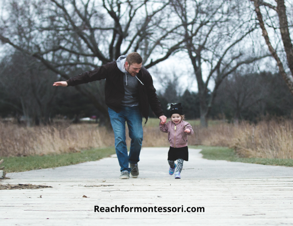 father running and laughing with son, and authoritative parenting style