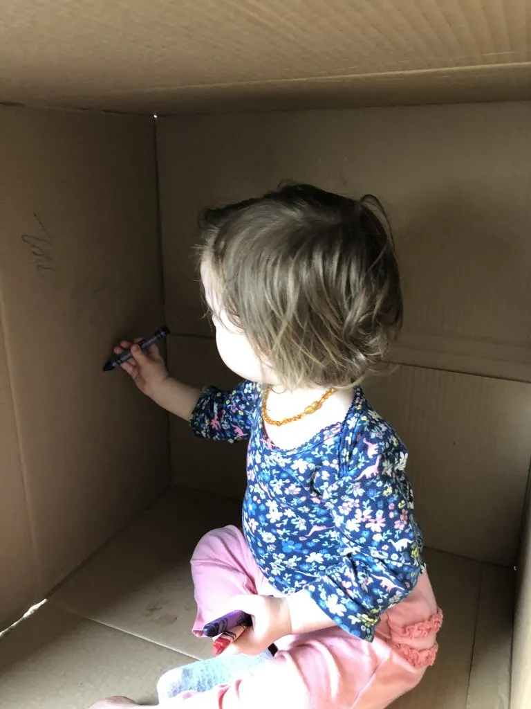 Toddler coloring inside box