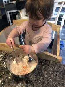 Toddler mixing slime