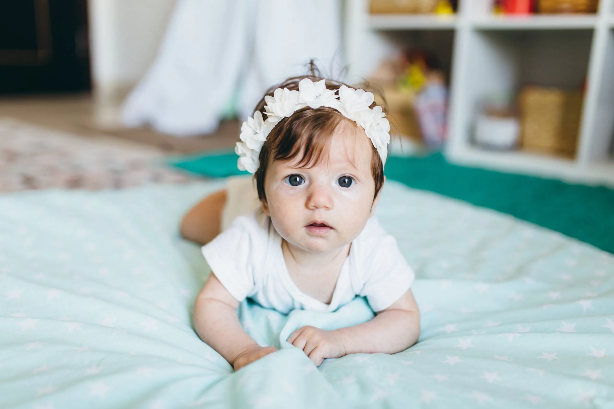 baby on tummy on floor.
