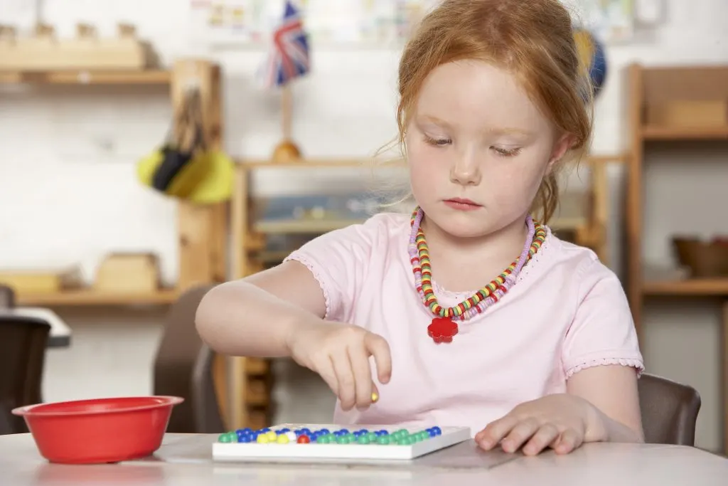 Montessori child working