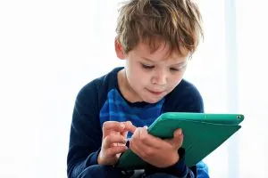 montessori taught online child looking at what learning app is best.