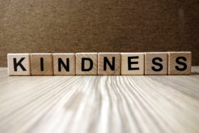 How to teach grace and courtesy, image of scrabble tiles spelling kindness.