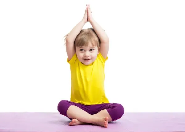 Child in Yoga pose. A heavy work exercise. 