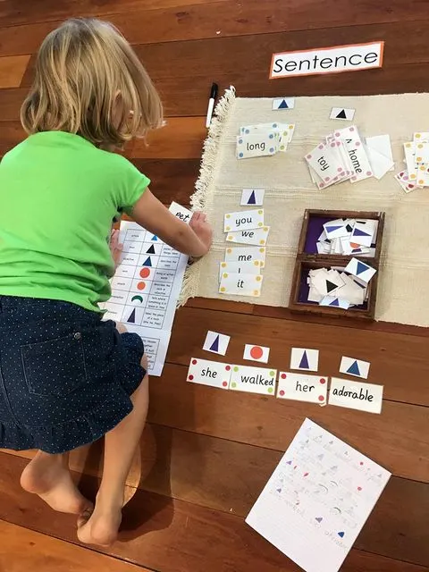 child working on Montessori work mat