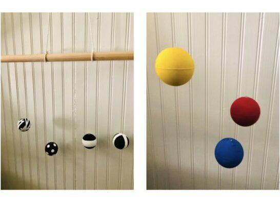 DIY Montessori baby mobile: black and white balls on left and image of yellow, red and blue on right.