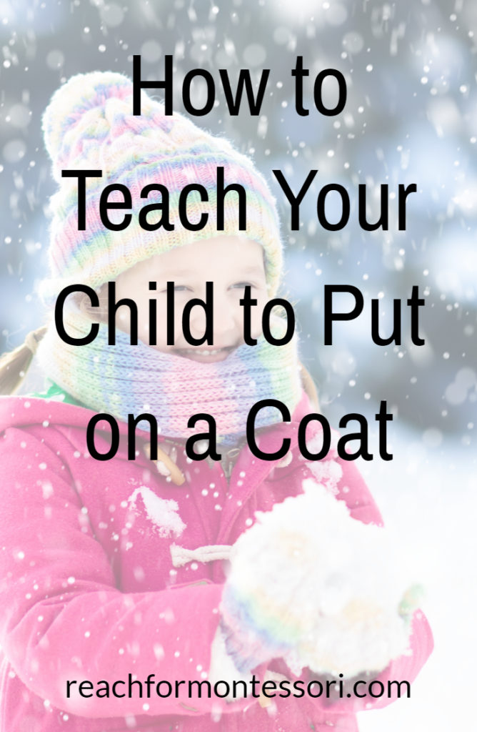 child putting on coat