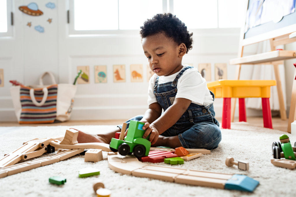 young child, playing independently.