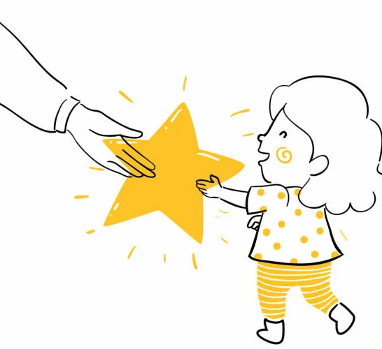 child getting gold star as reward.