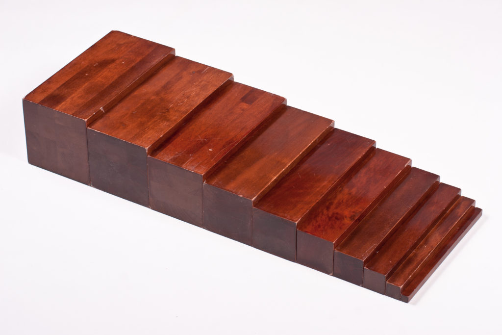 montessori brown stair, a montessori sensorial material.