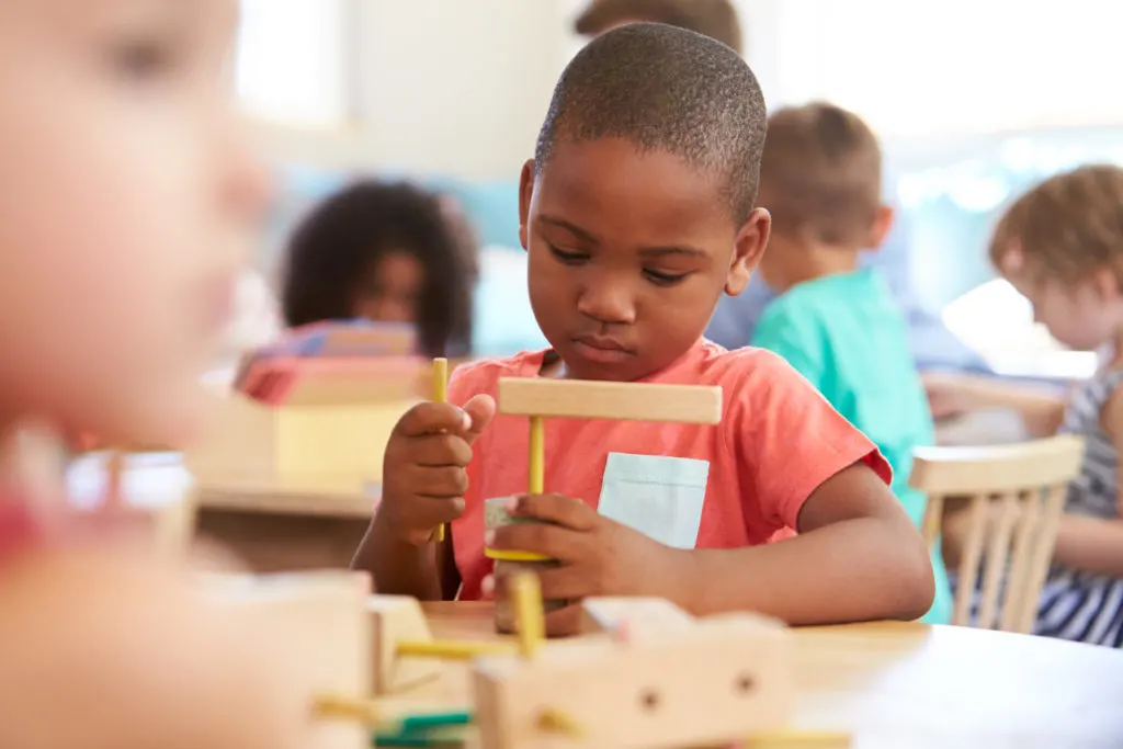 child working in montessori classroom