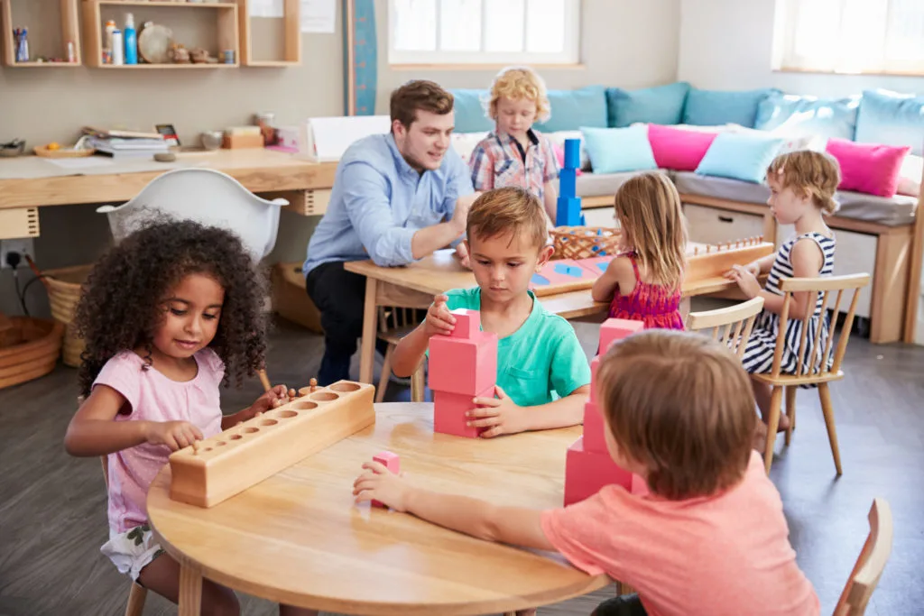 teacher with students showing neurodiversity in the montessori classroom