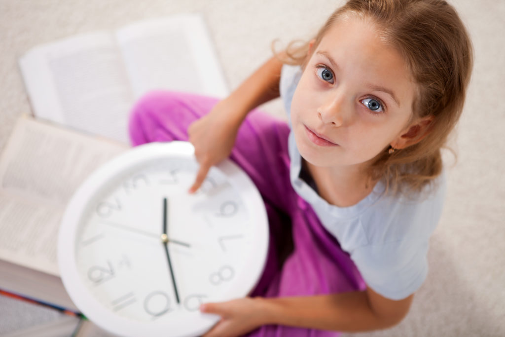 child learning patience with clock