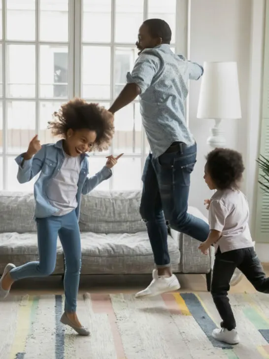 parent dancing with children as a music and movement activity.
