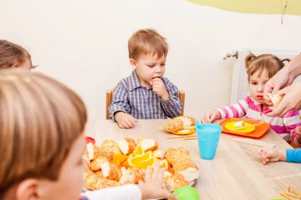 children gathered around small table.