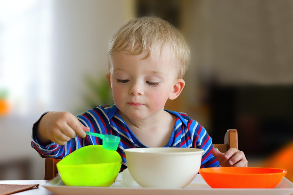 child scooping.
