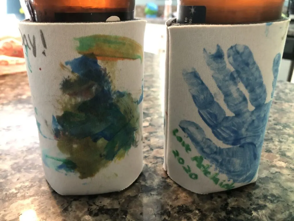 father's day craft drink koozie painted by toddler with handprint.