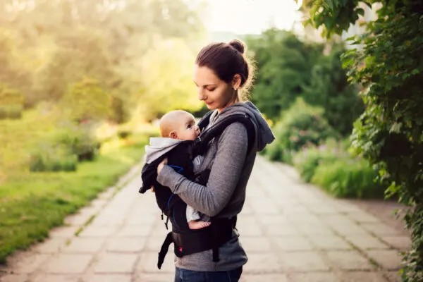 image of mother with baby in carrier.