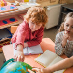 image of children taking part in 3 period lesson in Montessori.