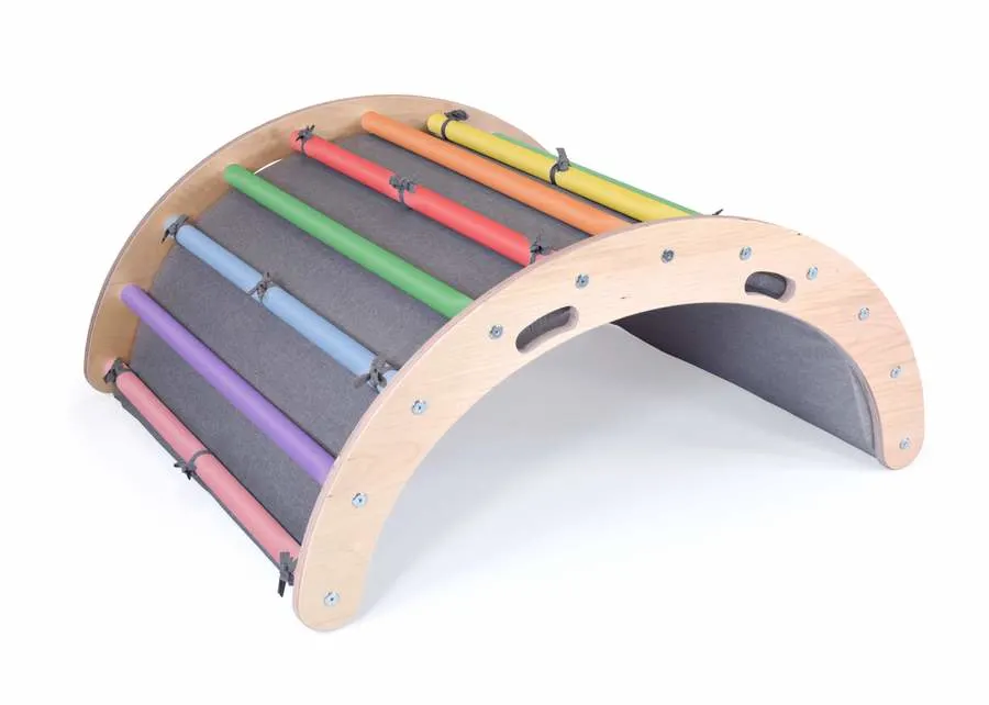 image of lily and river rainbow rocker, a montessori gross motor toys.