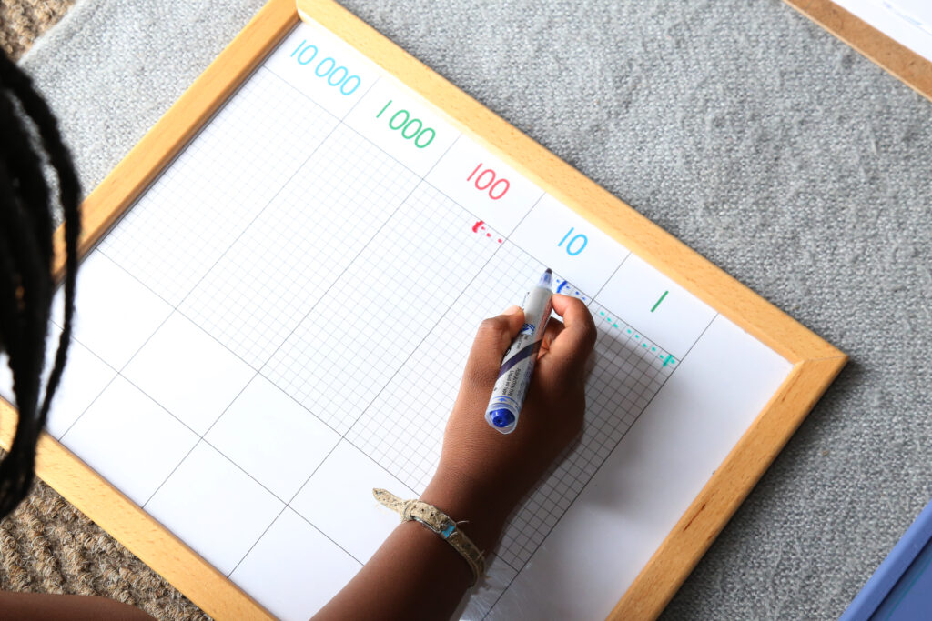 image of child playing the Montessori dot game.