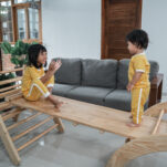 image of 2 children playing on montessori gross motor toys.