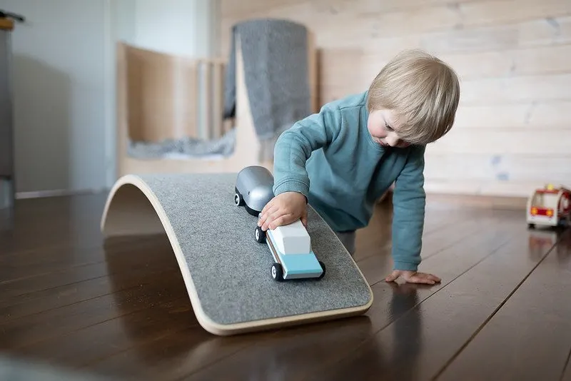 image of child playing with montessori balance boards.